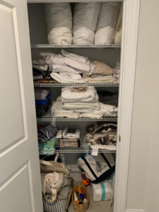 before and after linen closet organization